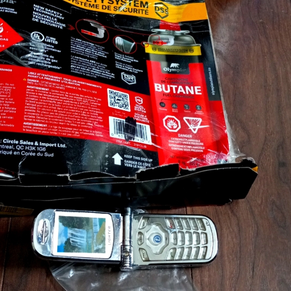 Cell phone light er for candles or smokes and refill can both new